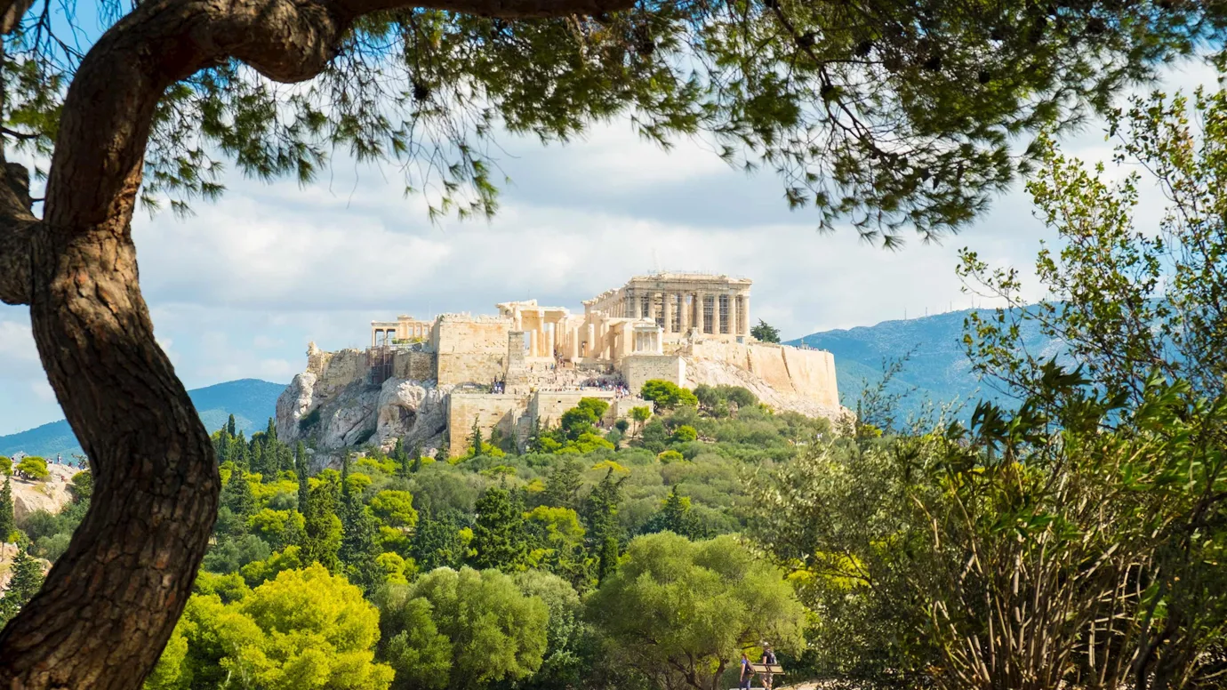 Historic structure overlooking a landscape with mountains in Athens, Greece