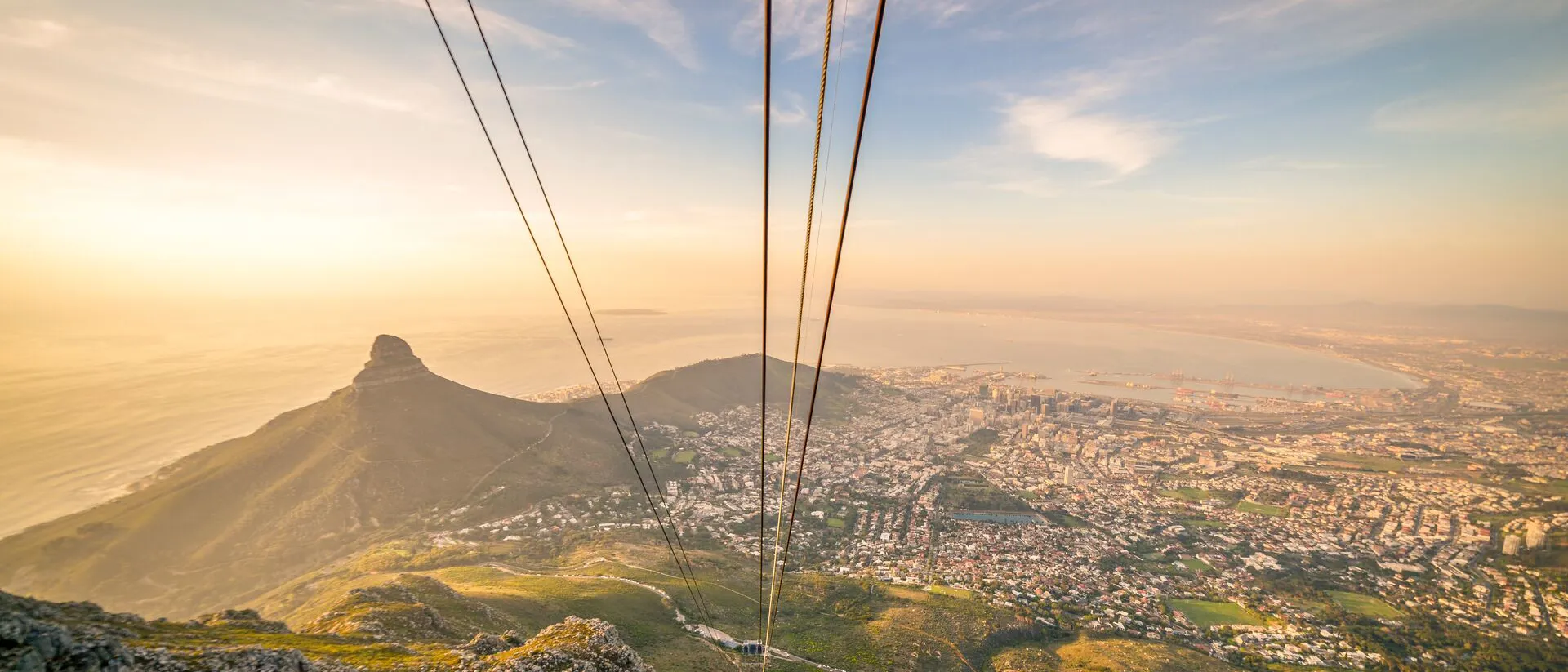 Cable Car in South Africa with mountain and sea in background