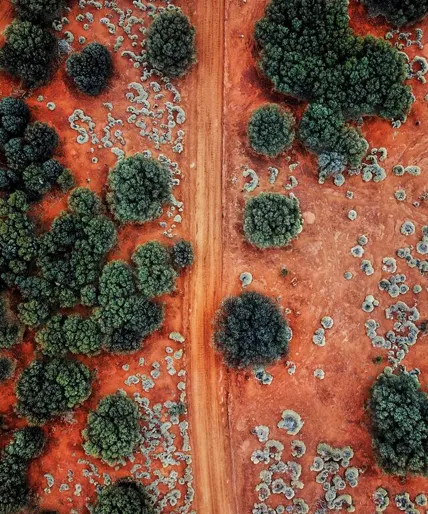 medium-an-aerial-shot-of-the-red-centre-roads-in-the-australian-outback-1071558994.jpg