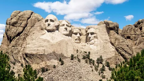 Mount Rushmore Monument under blue sky in South Dakota, United States