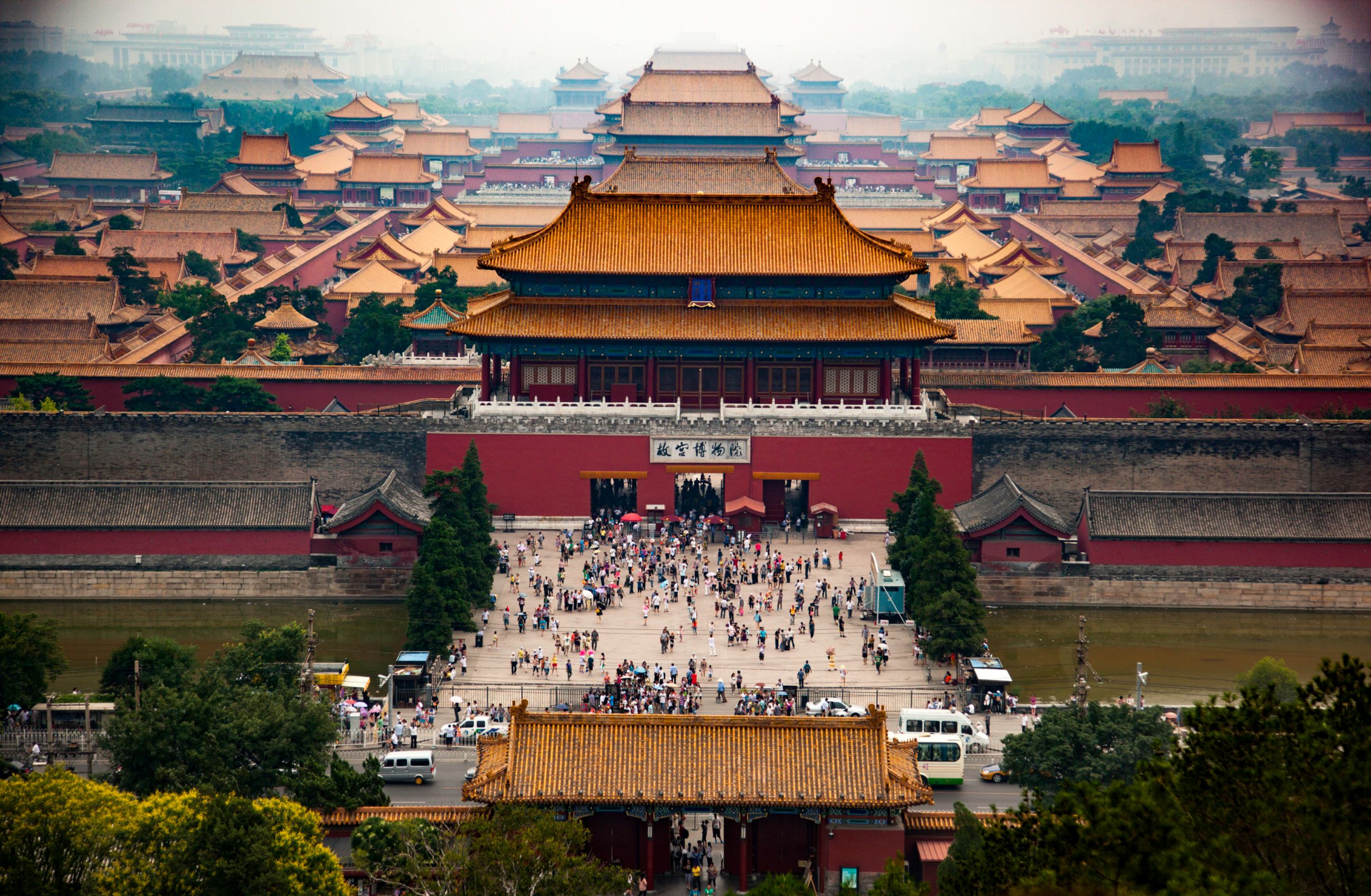 A large temple with red walls and a series of sweeping yellow tiled roofs, located in the Forbidden City, Beijing, China.