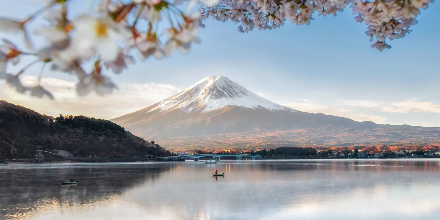 Fuji Mountain Reflection And Fisherman Boat With Sakura In Spring Blue Sky Sunny Day At Kawaguchiko Lake