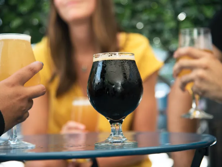 People drinking Guinness in Ireland bar