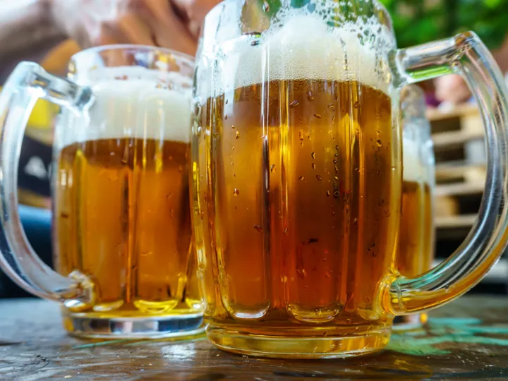 Three big glasses of golden-coloured Czech beer.