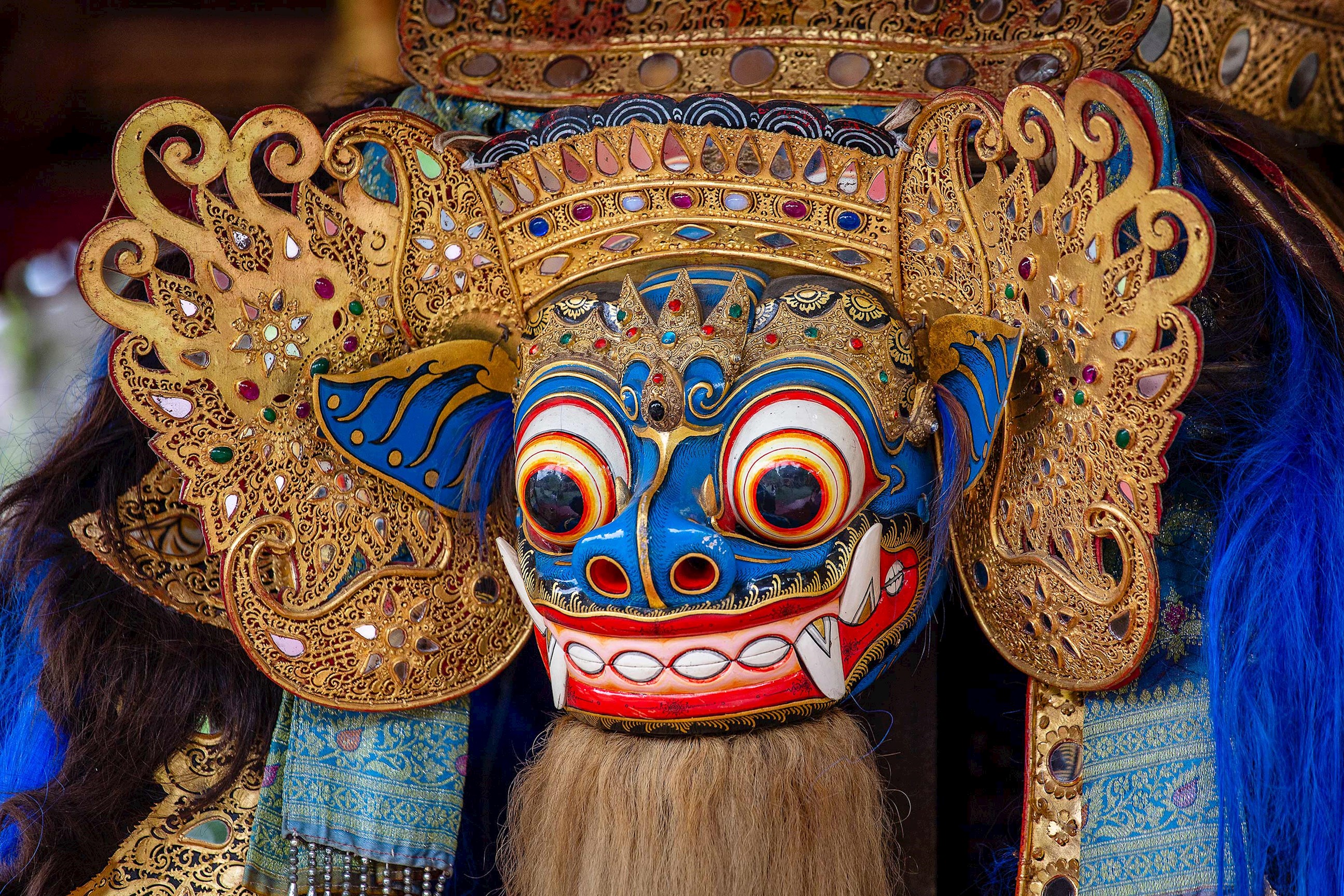 Colourful traditional Barong mask with gold details