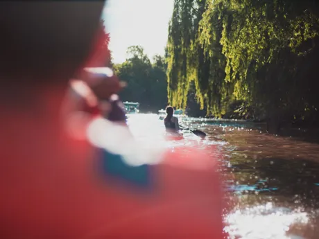 Woman kayaking up the Tigre Delta in Argentina, South America