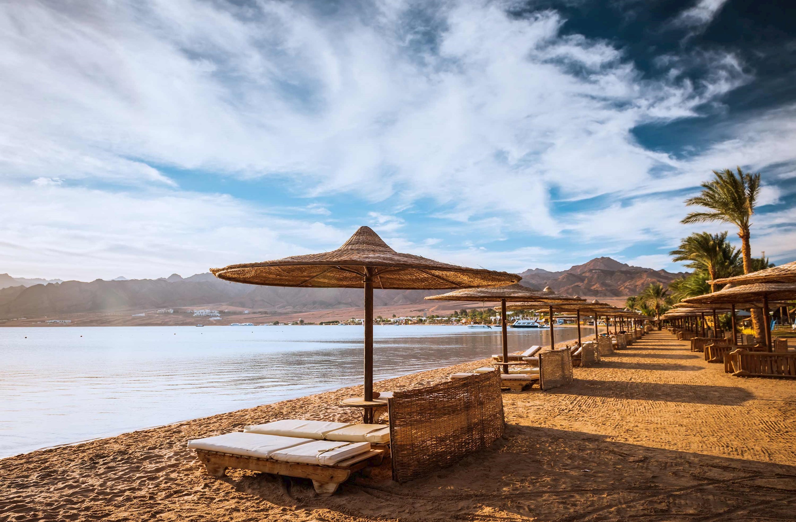A scenic beach view with mountain backdrop in Hurghada, Egypt