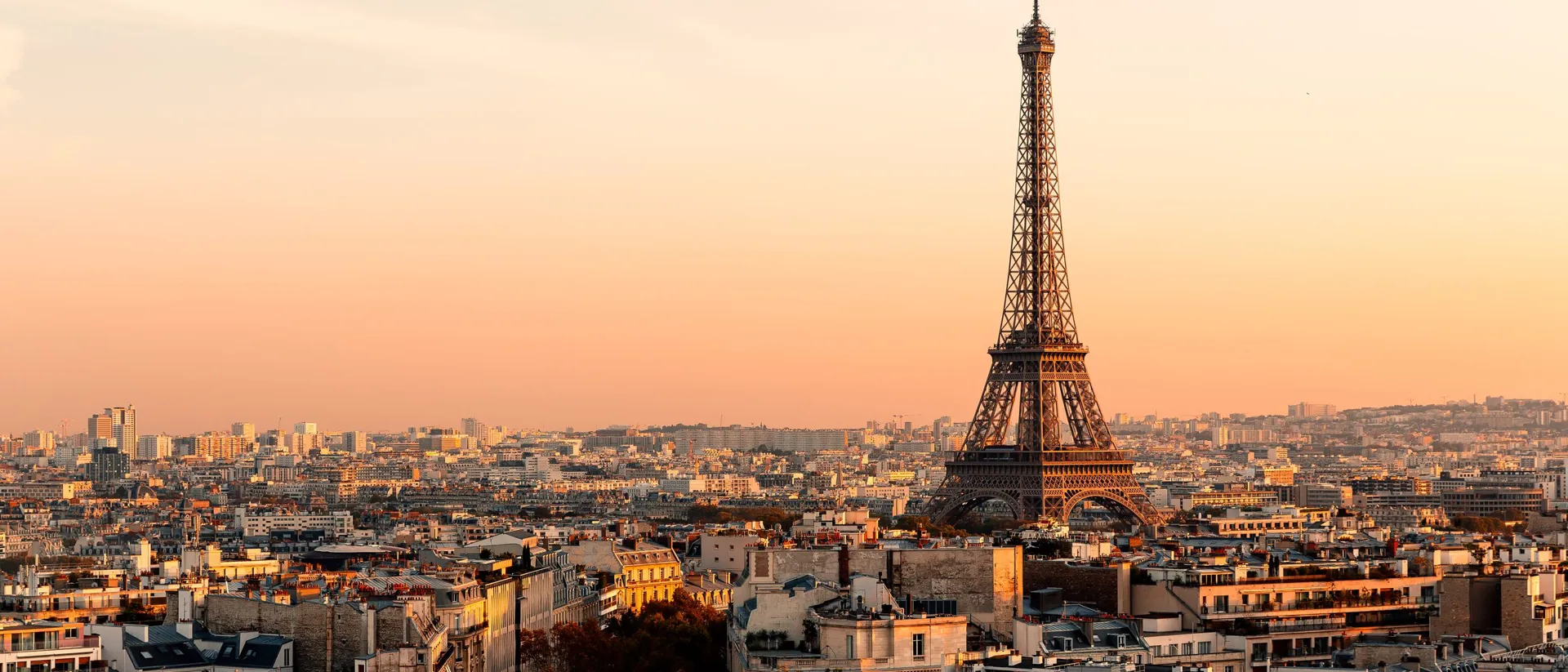 Aerial View Of Paris Streets And Eiffel Tower At Sunset