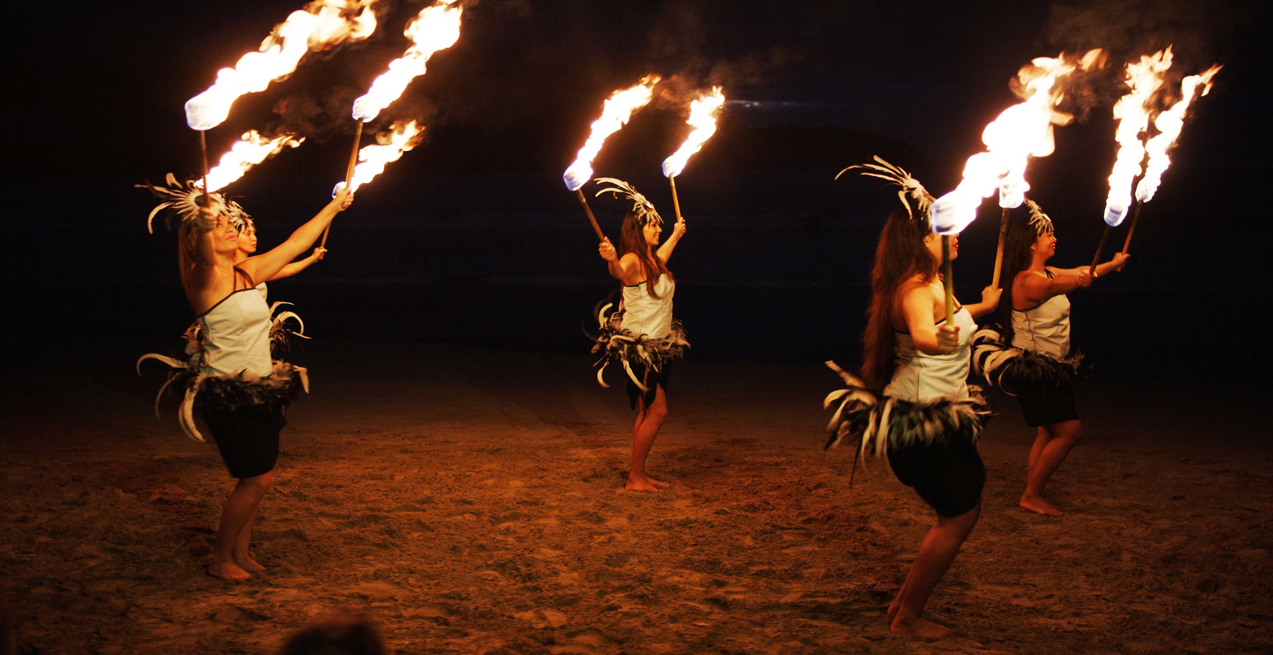 Polynesian fire dancing at the culture center in Laie, Hawaii, USA