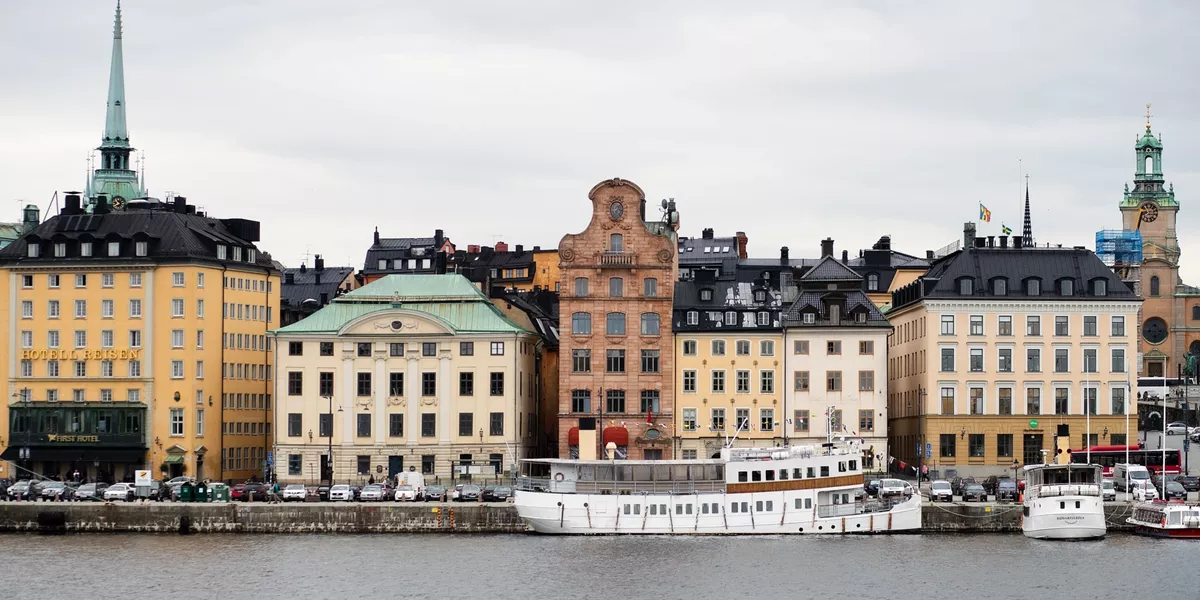 A row of buildings next to a river in Sweden Stockholm Island