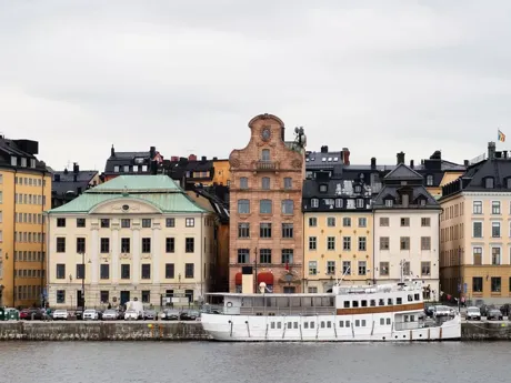 A row of buildings next to a river in Sweden Stockholm Island