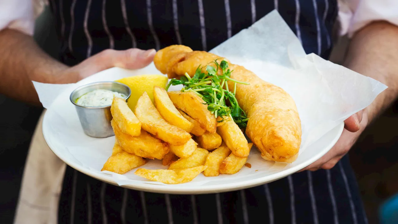 A plate of battered fish and chips