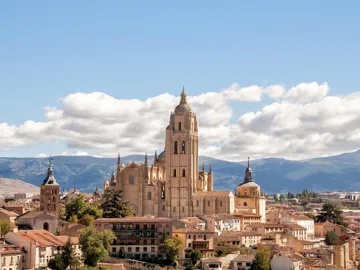 Panoramic view of historic cathedral and mountains in Madrid, Spain
