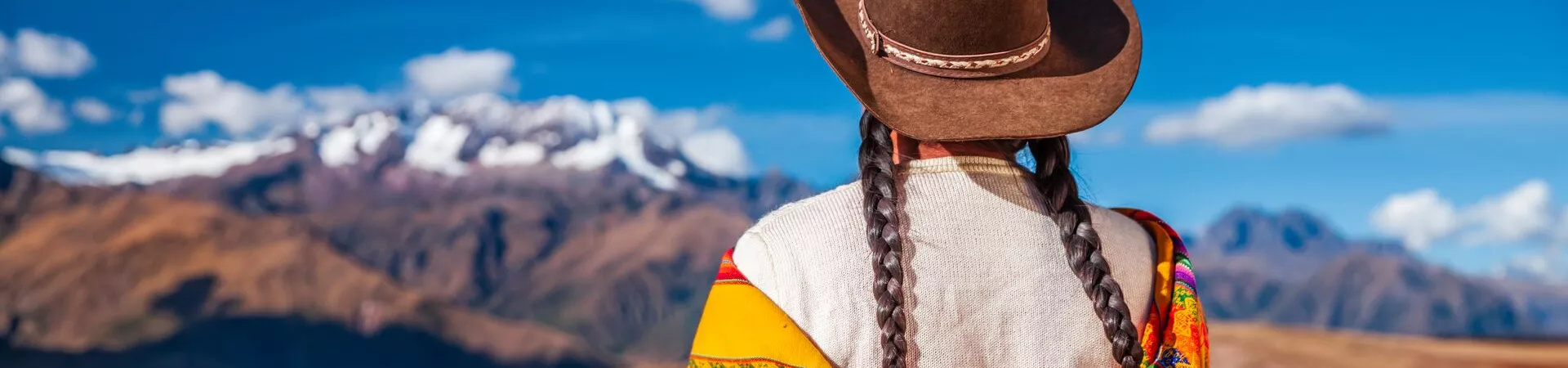 Peruvian Woman looking at Andes