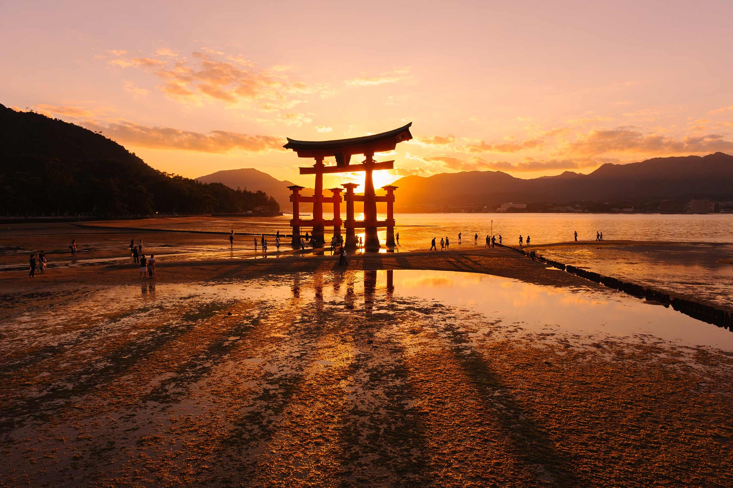 Sunset view of iconic Torii gate at Itsukushima Shrine, Miyajima
