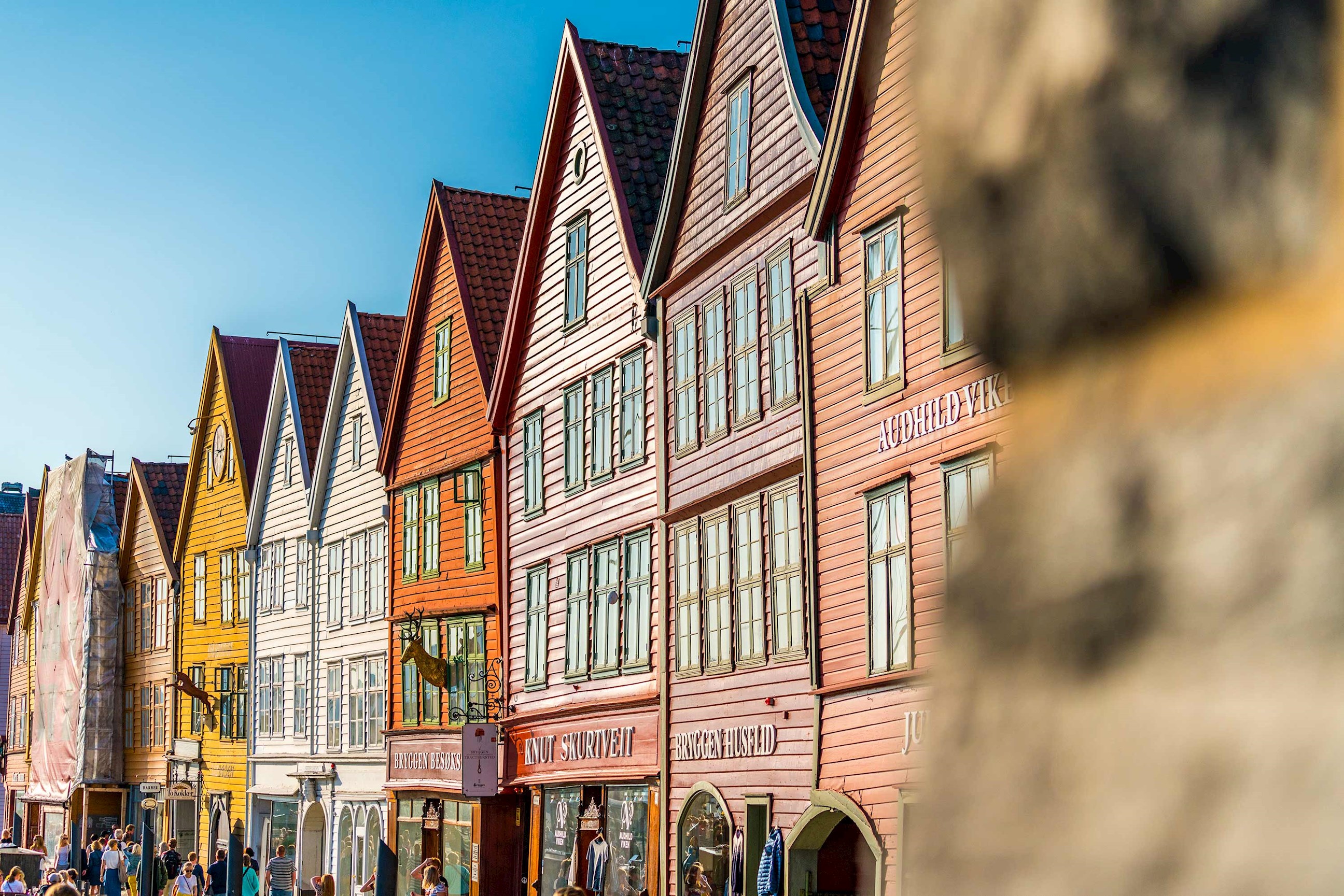 Row of colourful wooden buildings along a street in Bergen, Norway