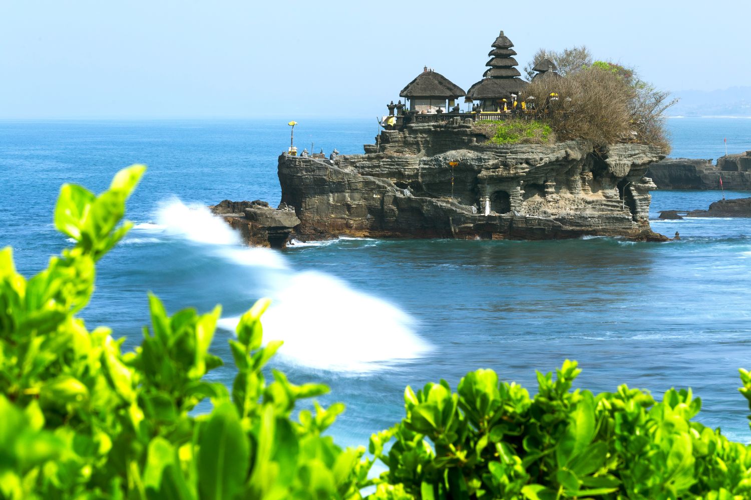 Tanah Lot Temple, on a tiny island surrounded by blue sea Bali Indonesia