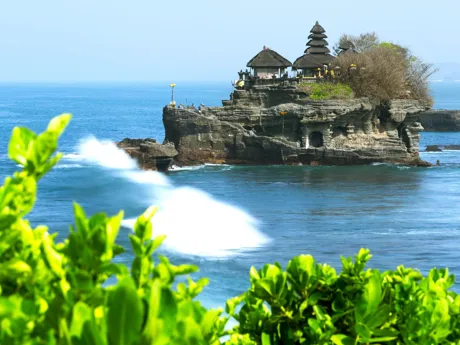 Tanah Lot Temple, on a tiny island surrounded by blue sea Bali Indonesia