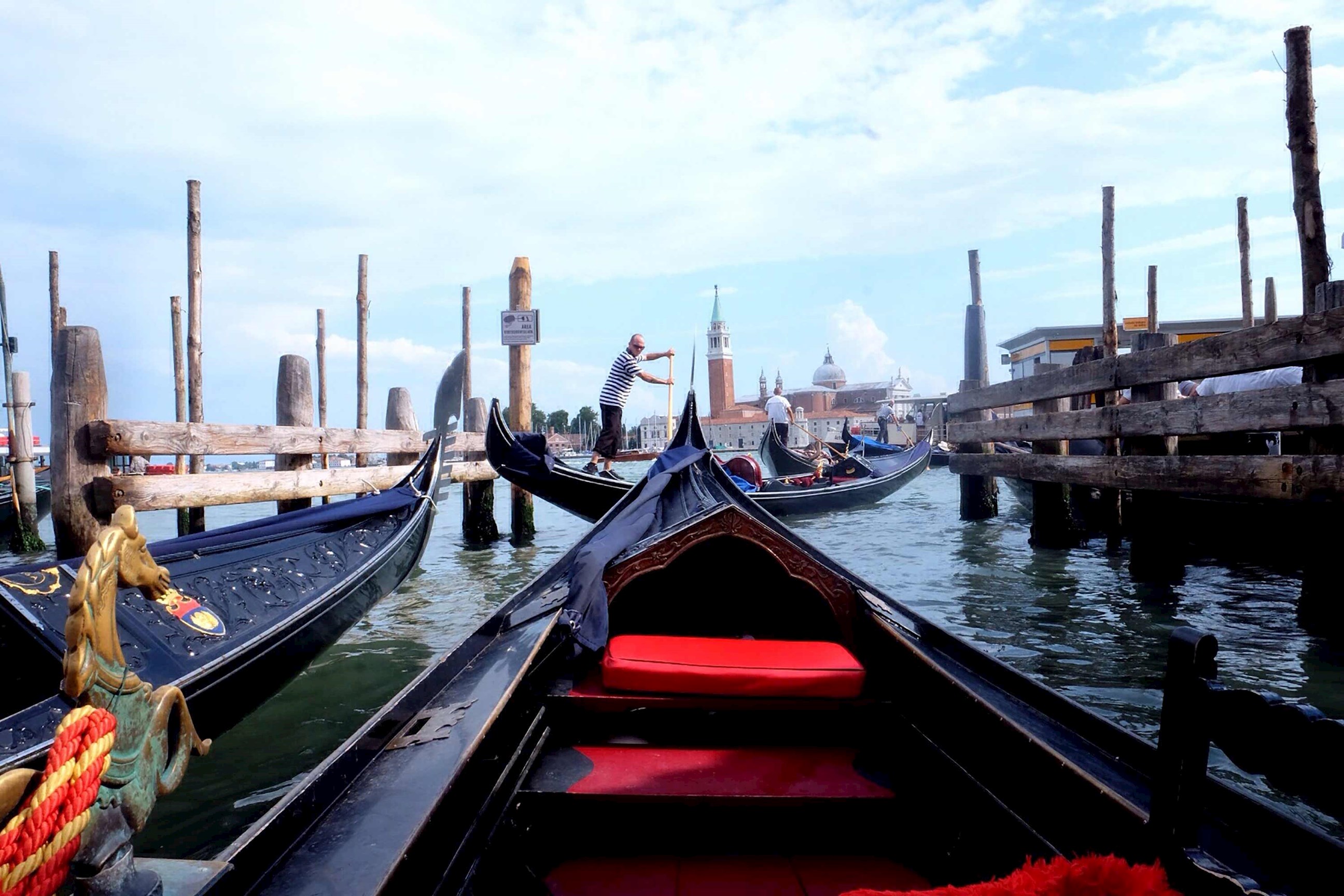 A Gondola on the canal with buildings in the distance in Venice, Italy